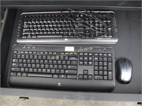 Two Keyboards And A Mouse