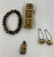 Lot with 2 bracelets, a charm and earrings