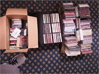 A large box of CDs and two books on CD, plus