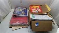 assorted kids books and craft supplies