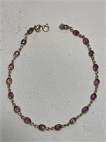 14k GOLD BRACELET WITH RED STONES 7.25in L