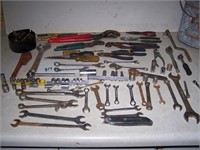 Lots of tools and pliers in a bucket