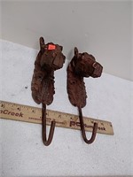 Two horse metal hooks
