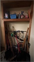 Items on shelf and yard tools