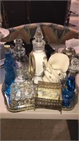 Mirrored dresser tray with bottles and jars on