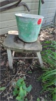 GALVANIZED BUCKET AND AN OLD TABLE