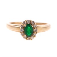 A Lady's Emerald and Diamond Ring in Gold