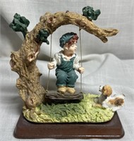 Boy Swinging with Dog Resin Figurine