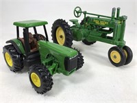 Two John Deere toy tractors