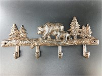 Very detailed cast iron 4 hook wall hanger depicti