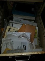 Contents of drawer mostly owners manuals