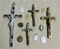 Hanging Crucifixes and Saint Medallions.