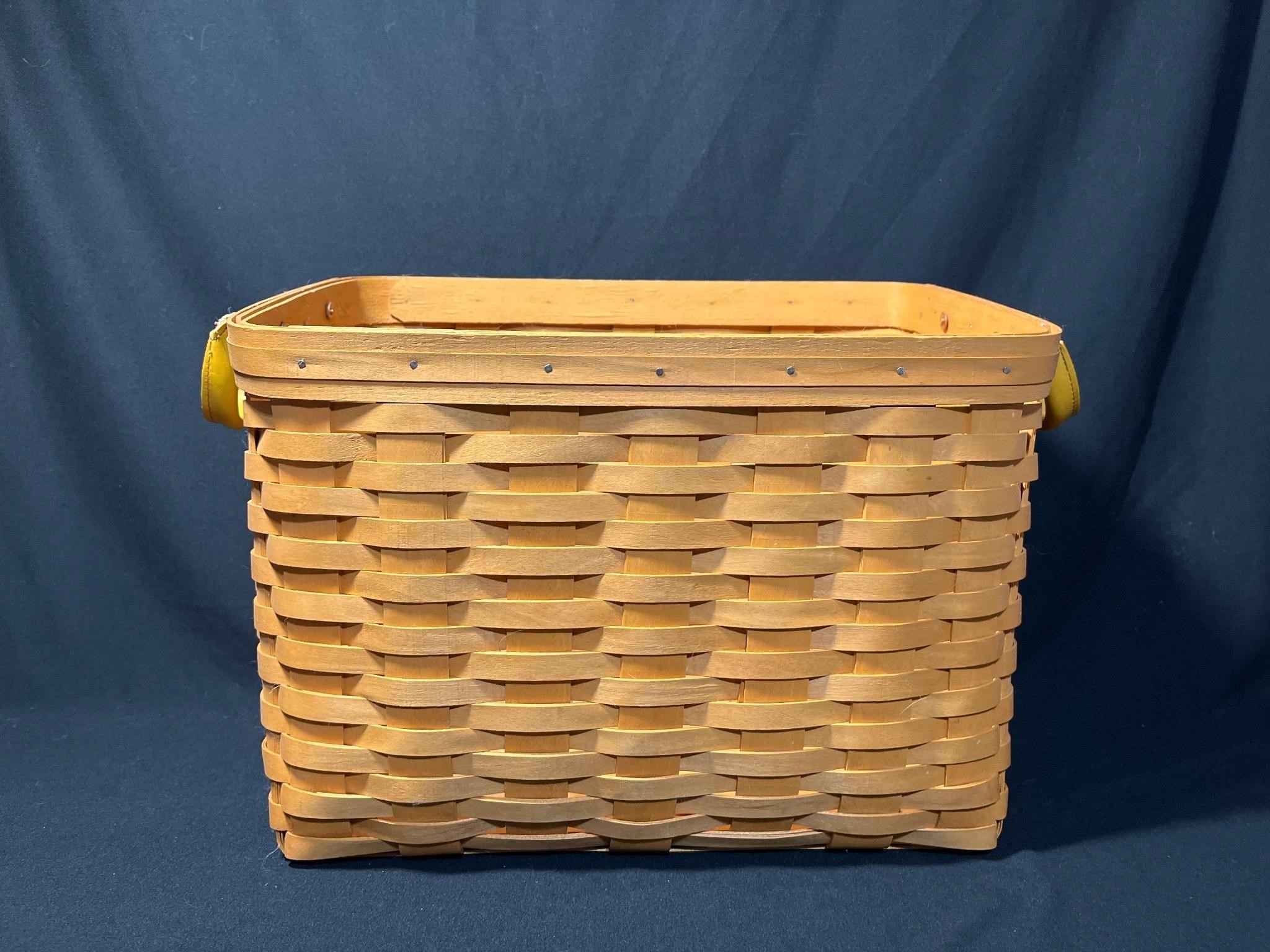 Longaberger Handwoven basket with leather handles.