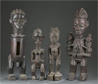 4 African standing wooden figures. 20th century.