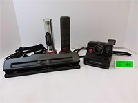 Retro Polaroid instant camera and flashlights