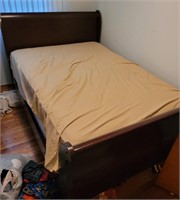 Full size bed frame with head and foot boards.