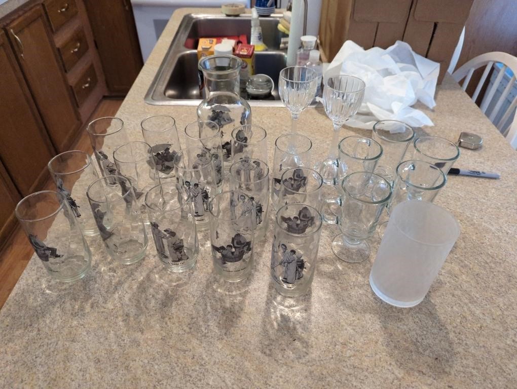 Assortment of glassware including Norman Rockwell