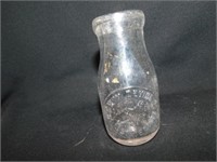 Wm. M. Devine 1/2 pint milk bottle, est. 1864, 71