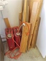 651- 2 Metal Gas Cans And Mixed Wood