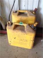 Two yellow gas cans
