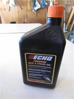 partial jug of echo bar & chain oil