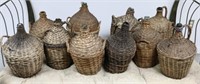 COLLECTION OF 10 WICKER WRAPPED GLASS BOTTLES,