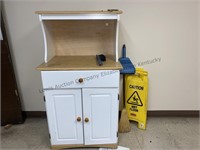 Microwave cabinet with two caution wet floor