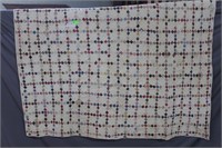 Quilt with patchwork pattern in cream