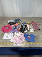 Assortment of Build A Bear clothes and shoes,