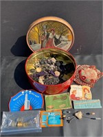 Vintage tin full of old sewing items