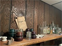SHELF WITH COLLECTIBLES AND  BEER BOTTLES