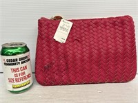 Neiman Marcus pink clutch has staining on outside