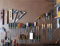 Qty of tools hanging on peg board to include: