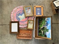 lot of frames and cat fabric wall hanging