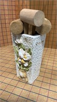 Small wooden mallet and vase