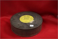 Vintage film tin full of records