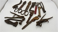 Antique pipe wrenches and tin snips
