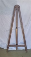 Folding art easel with movable pegs. 50ins.
