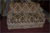 Allover floral upholstered love seat