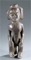 Fang style seated female figure. 20th century.