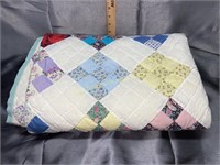 Old hand made diamond pattern quilt