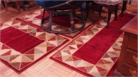 Two throw rugs and matching runner with