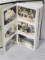 205 vintage postcards in binder