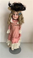 Antique leather body doll w/ music box hole