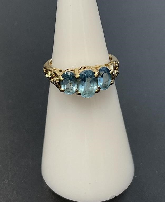 10 KT Blue Topaz and Diamond Ring