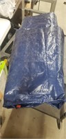 Blue plastic tarp with grommets size unknown