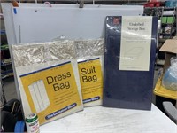 Under Ed storage box and dress and suit bags