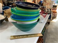 stack of plastic bowls and strainers