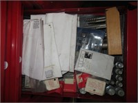 Contents of drawer that includes screw
