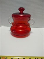 Stunning hand blown glass handled jar with lid.